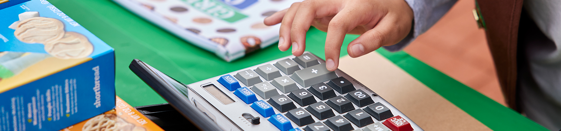  photo of calculator and girl scout cookie boxes 